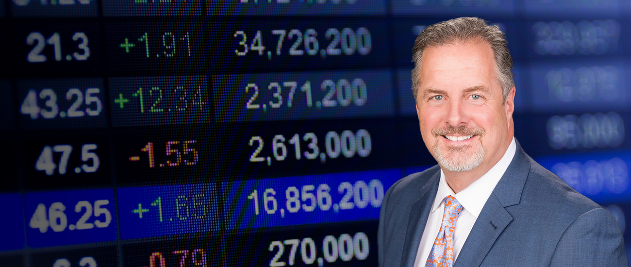 Attorney Bryan T. Forman and a stock market board in the background